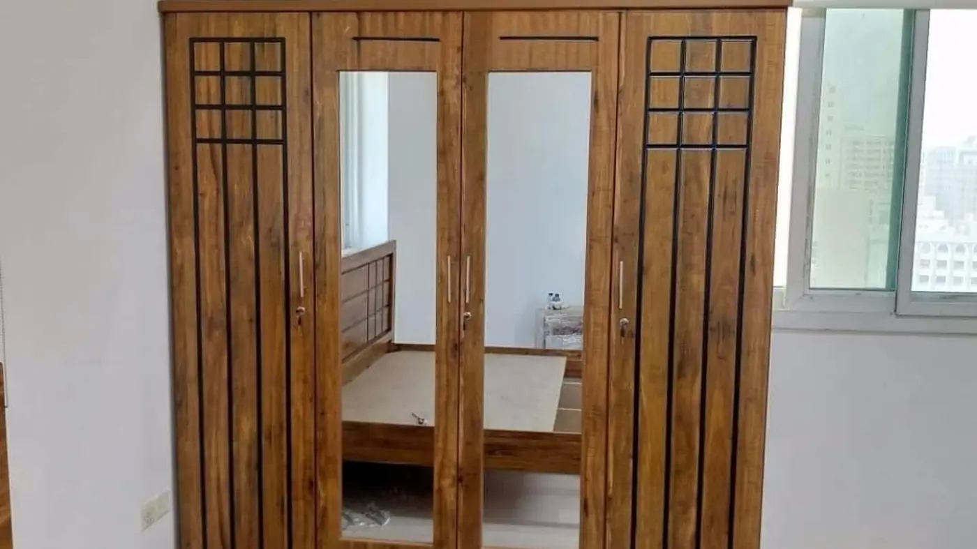 Solid teak four-door mirrored wardrobe